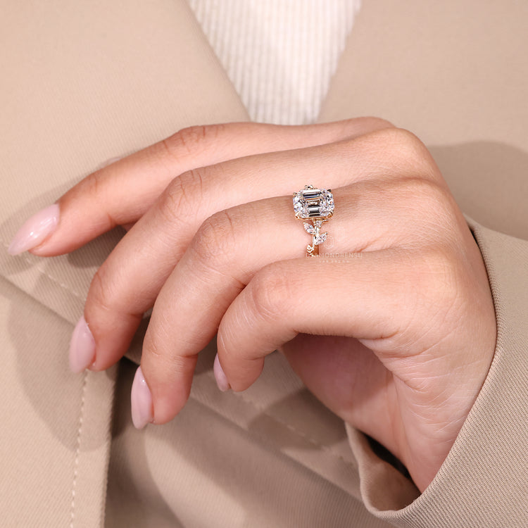 Nature inspired ring with emerald old european cut diamond and leaf prong.
