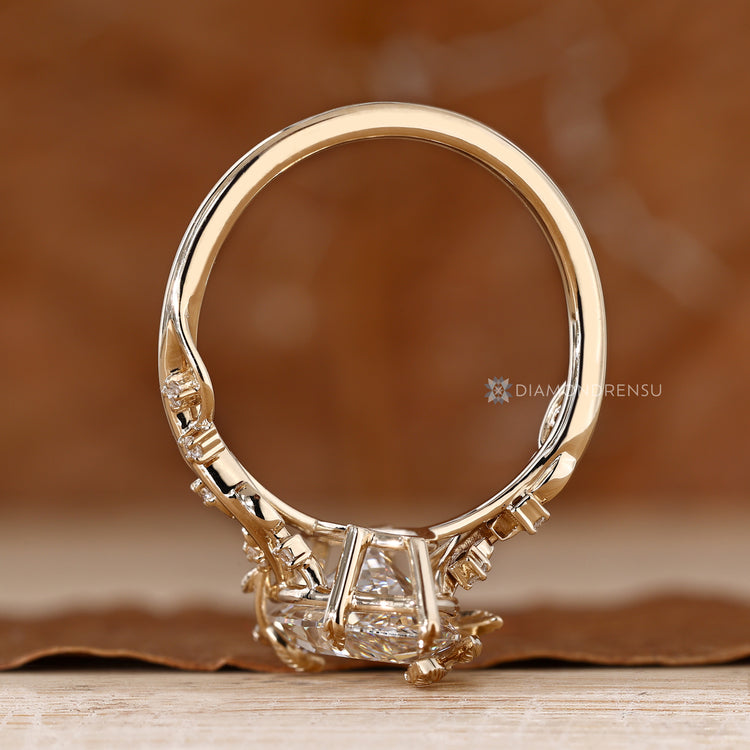 Marquise diamond ring with leaf style prong setting.