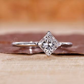 Compass prongs hold the diamond in perfect alignment.
