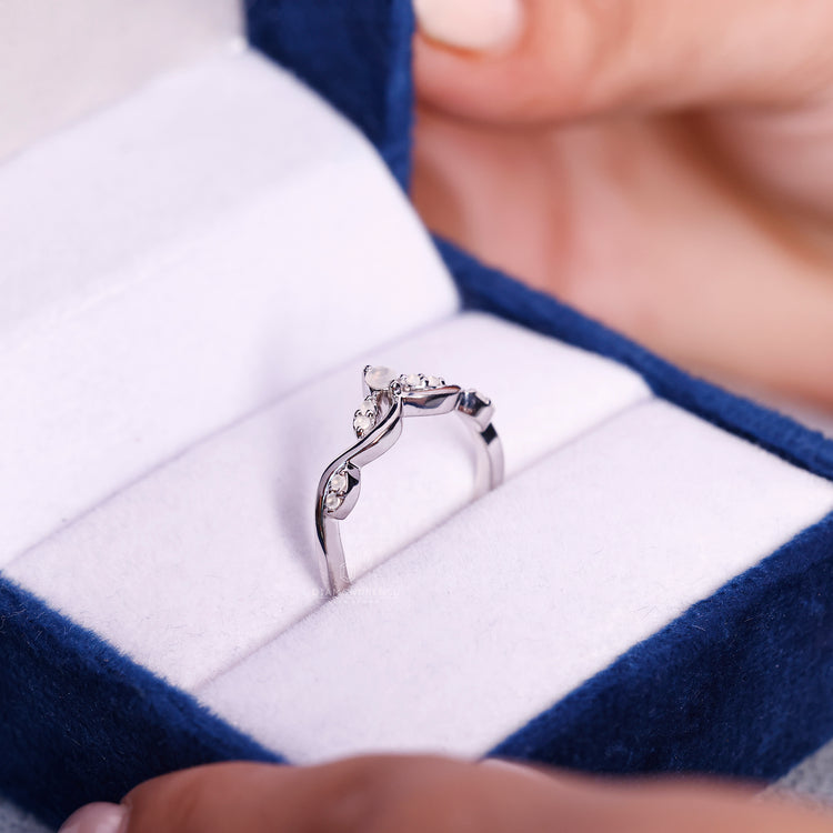 June birthstone moonstone wedding band with prong setting.
