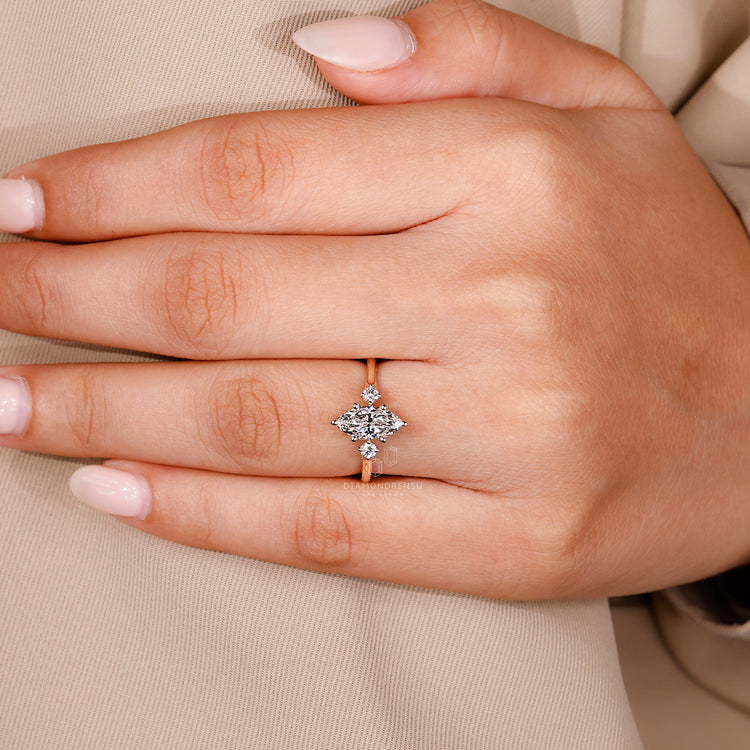 Marquise diamond engagement ring with a six-prong setting, showcasing the marquise stone's shape and brilliance.
