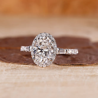 Oval cut diamond ring with a classic halo engagement ring setting.
