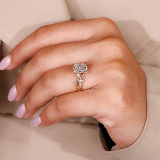 Radiant lab grown diamond ring with round and marquise side accents
