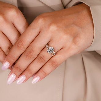 Custom radiant diamond ring with leaf-style prong and IGI certified stone
