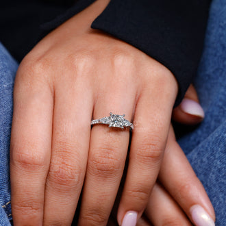 Pear and round cut engagement ring made with cathedral setting and four prong engagement ring detail.
