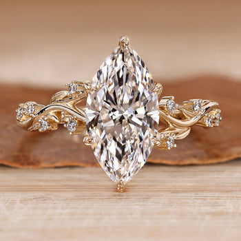 Marquise engagement ring with round side stones.
