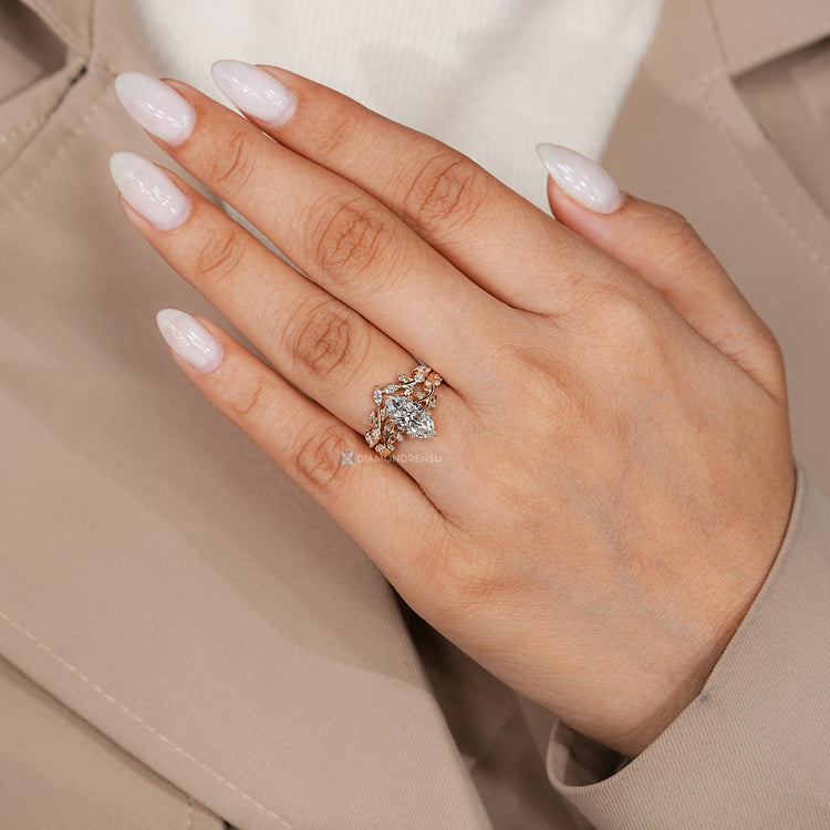 Marquise bridal set with hidden round cut green emerald.