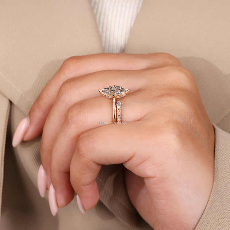 Compass prong setting secures the center stone.
