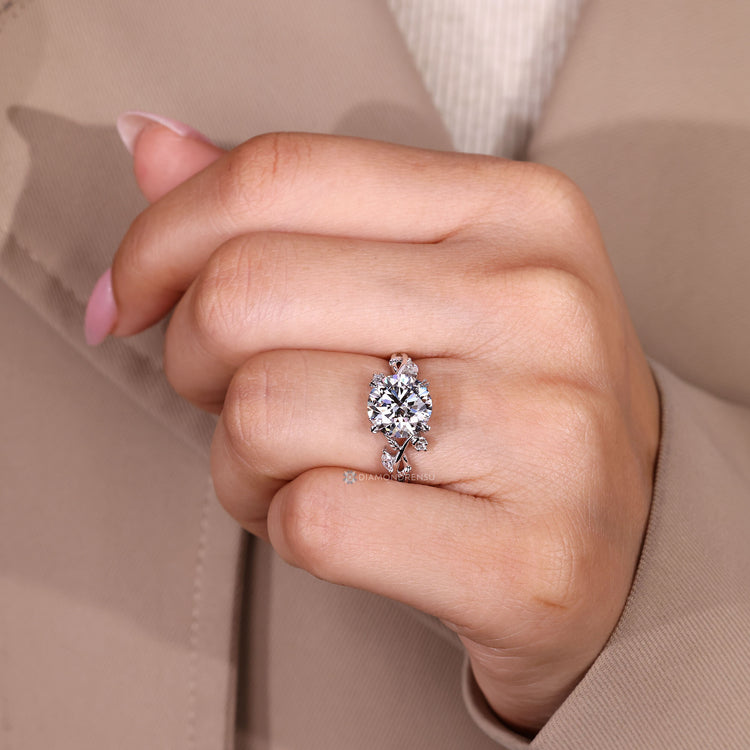 Four leaf style prong setting on a nature inspired engagement ring.