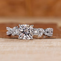 Marquise and round side stones complement this trellis engagement ring.