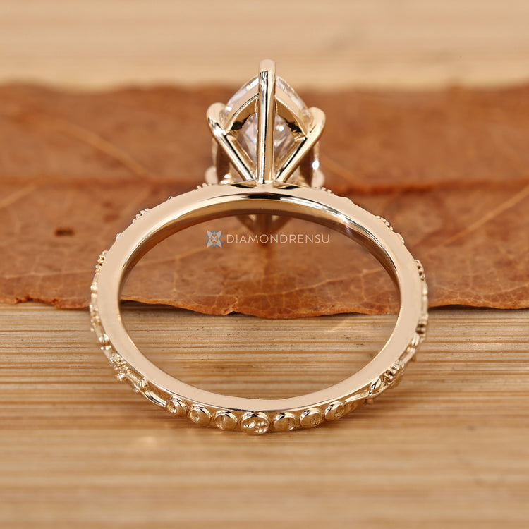 Lab grown diamond solitaire ring with a marquise cut.