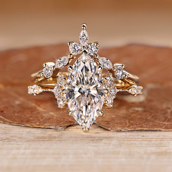 Marquise wedding ring with round side stones and vintage style.