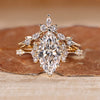 Marquise wedding ring with round side stones and vintage style.