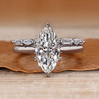 Marquise wedding ring with nature inspired leaf details.