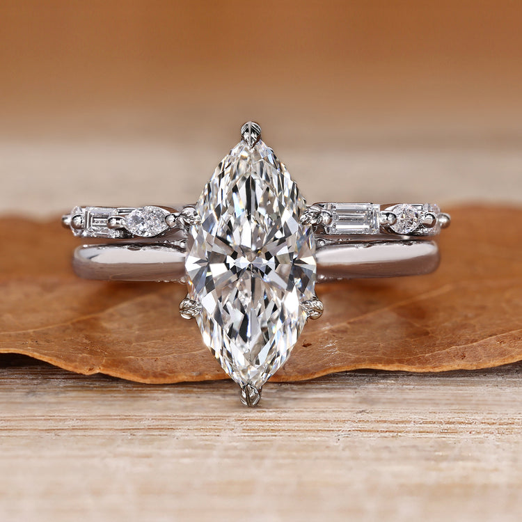 Marquise wedding ring with nature inspired leaf details.