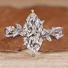 Nature inspired engagement ring with marquise diamond and twisted shank.