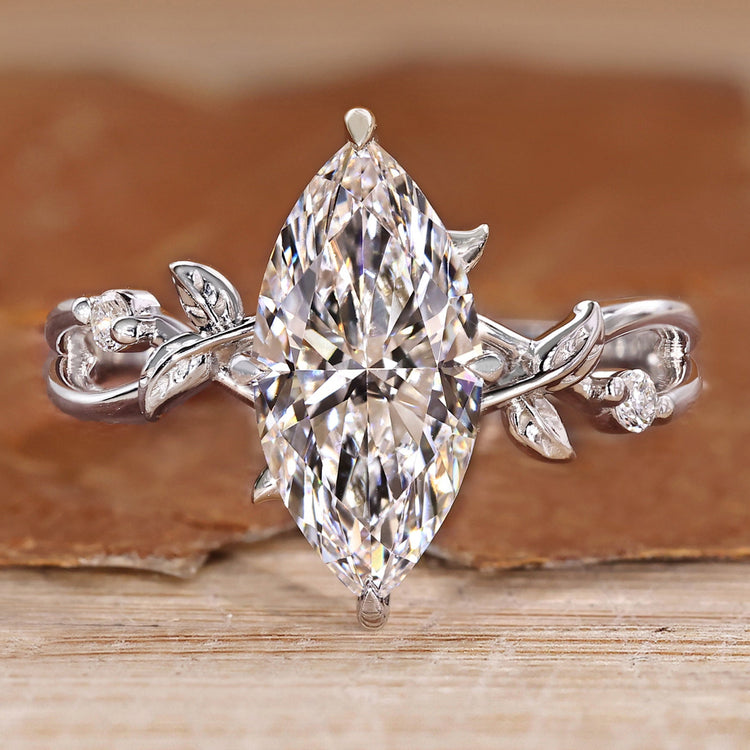 Nature inspired engagement ring with marquise diamond and twisted shank.