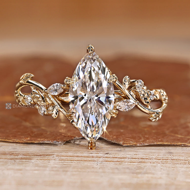 Diamondrensu marquise ring with lab grown diamond center stone.