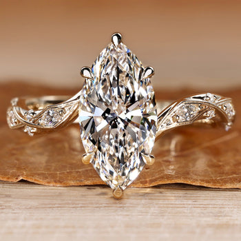 Marquise engagement ring with round and marquise side stones.