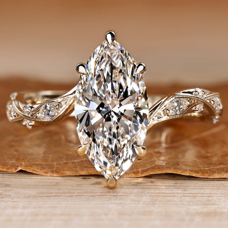Marquise engagement ring with round and marquise side stones.