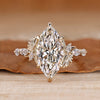 Marquise cut diamond ring with marquise side stones.