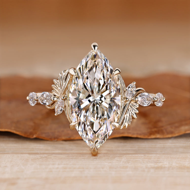 Marquise cut diamond ring with marquise side stones.