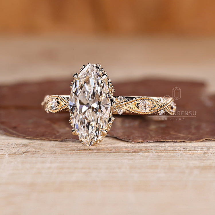 Art Deco Marquise Ring featuring round cut hidden accents and four claw prong.
