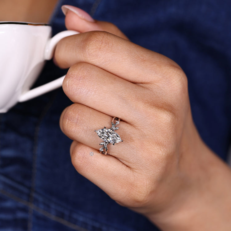 Lab grown marquise diamond ring with hidden halo style round diamonds.