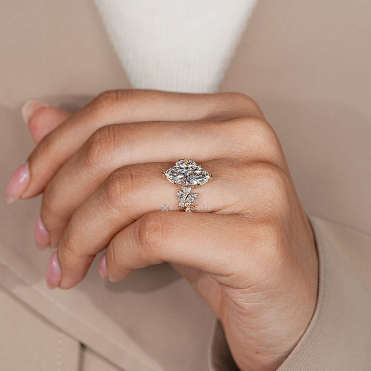 Marquise engagement ring with a cluster setting.