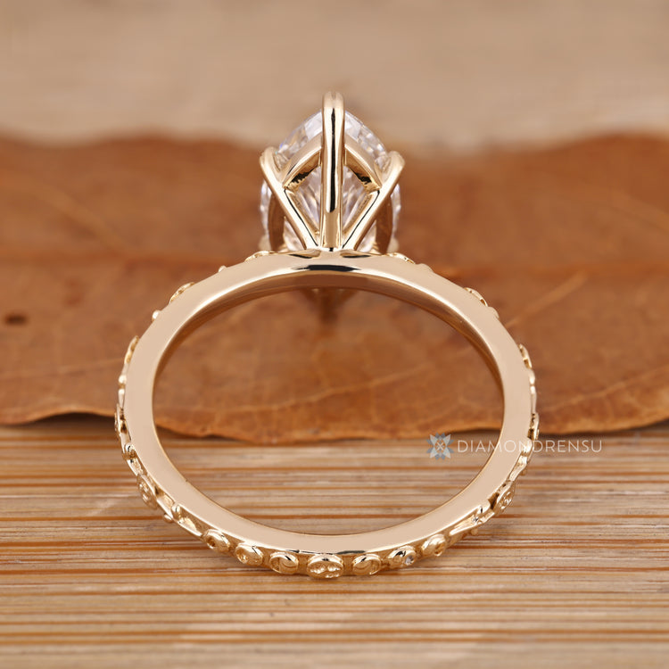 Art Deco marquise engagement ring with a flower style.