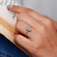 Three stone engagement ring marquise center pear sides.