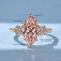Marquise ring with pink center and cluster setting.