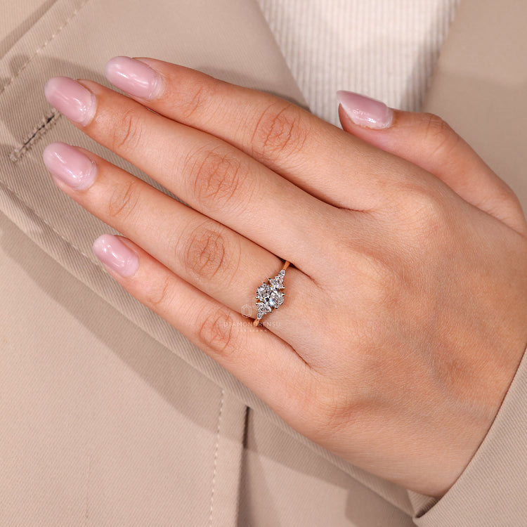 Oval engagement ring with sparkling side stone accents.