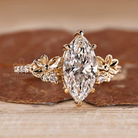 IGI certified marquise ring with floral design and pave band.