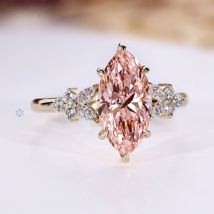 Handmade marquise engagement ring with pink center diamond.
