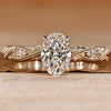 Oval diamond ring with round and marquise side stones.