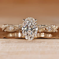 Oval diamond ring with round and marquise side stones.
