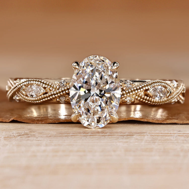 Oval diamond ring with round and marquise side stones.