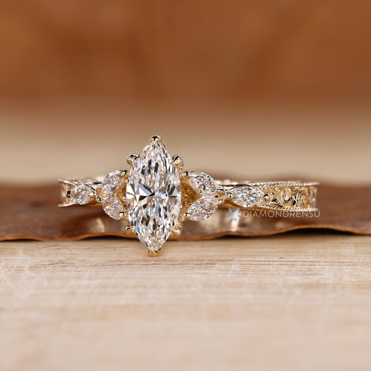 Tulip setting paired with marquise side stones and milgrain details.