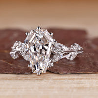 Diamondrensu coffin ring with lab grown diamond center stone.