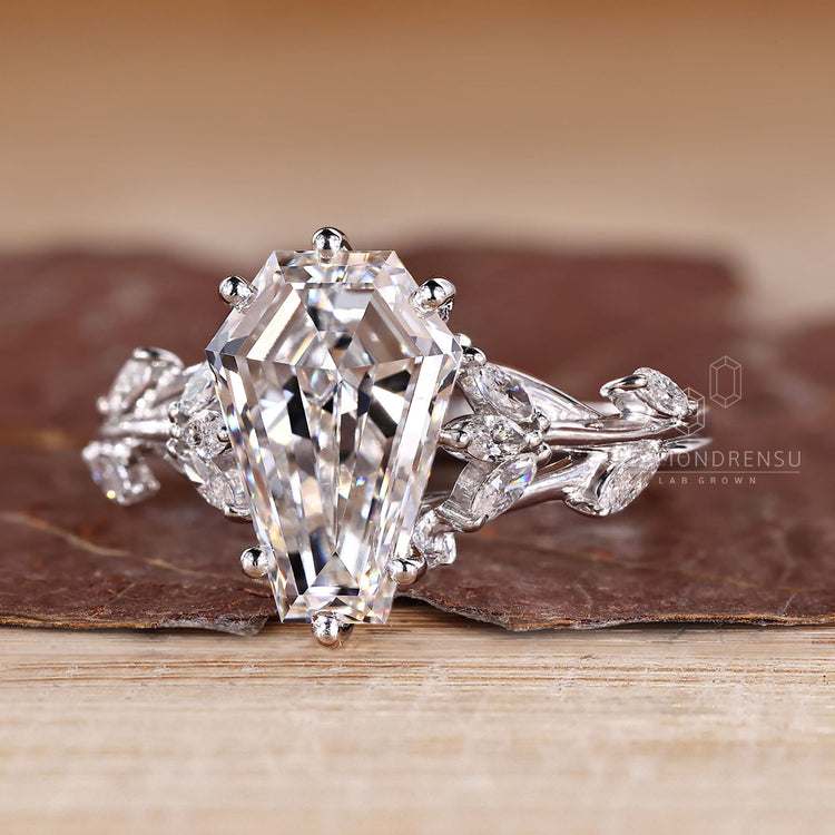 Diamondrensu coffin ring with lab grown diamond center stone.