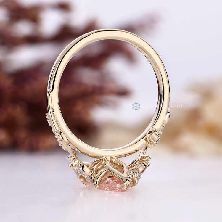 Diamondrensu handmade ring with a pink marquise center stone.