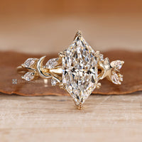 Dutch marquise ring with round and marquise side stones.