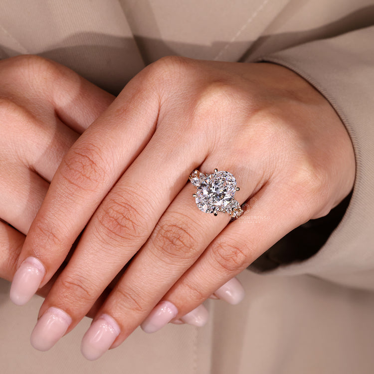 Cluster setting oval lab grown diamond ring.
