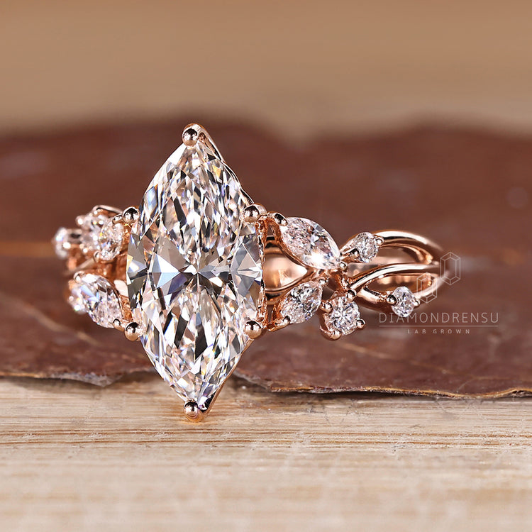 Diamondrensu marquise ring with lab grown diamond center.