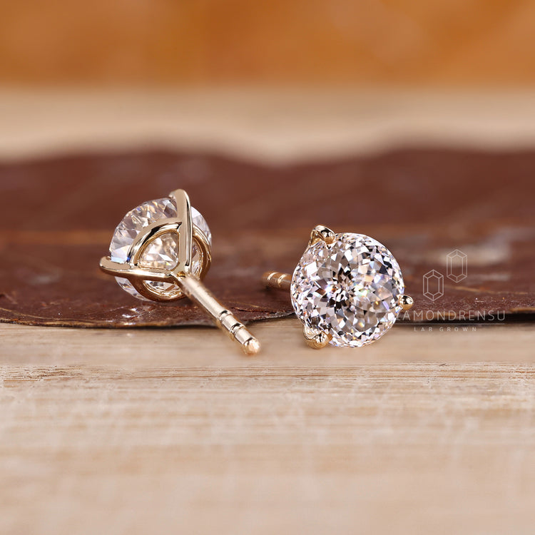 Portuguese diamond stud earrings with martini basket and prongs.