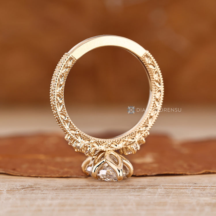 Dutch marquise ring with tulip setting and milgrain detailing.
