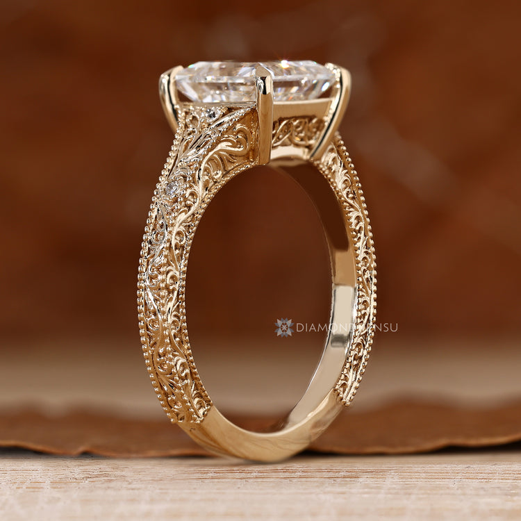 Art Deco engagement ring with milgrain details and a tapered shank.