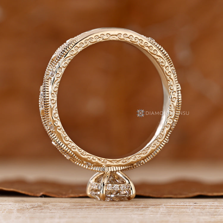 Oval diamond ring with round diamond hidden halo.