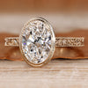 Oval lab grown diamond ring with bezel setting.